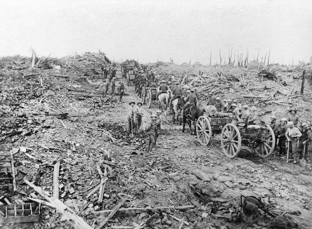 Ammunition limbers, drawn by horses, pass through the ruined village of Longueval, September 1916.